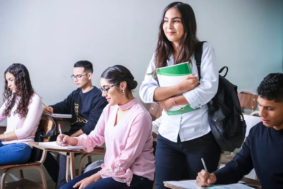 Students working on laptops in a classroom